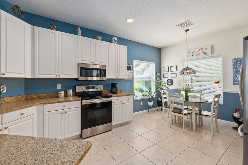 Photo of 213 SW Deleon Springs Drive, Port Saint Lucie, FL 34986 (MLS # R11106980)
