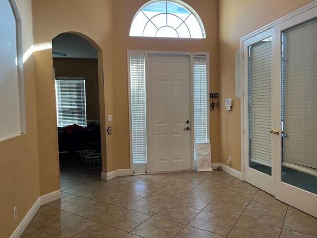 Photo of 1749 SW Desert Avenue, Port Saint Lucie, FL 34953 (MLS # R10938144)