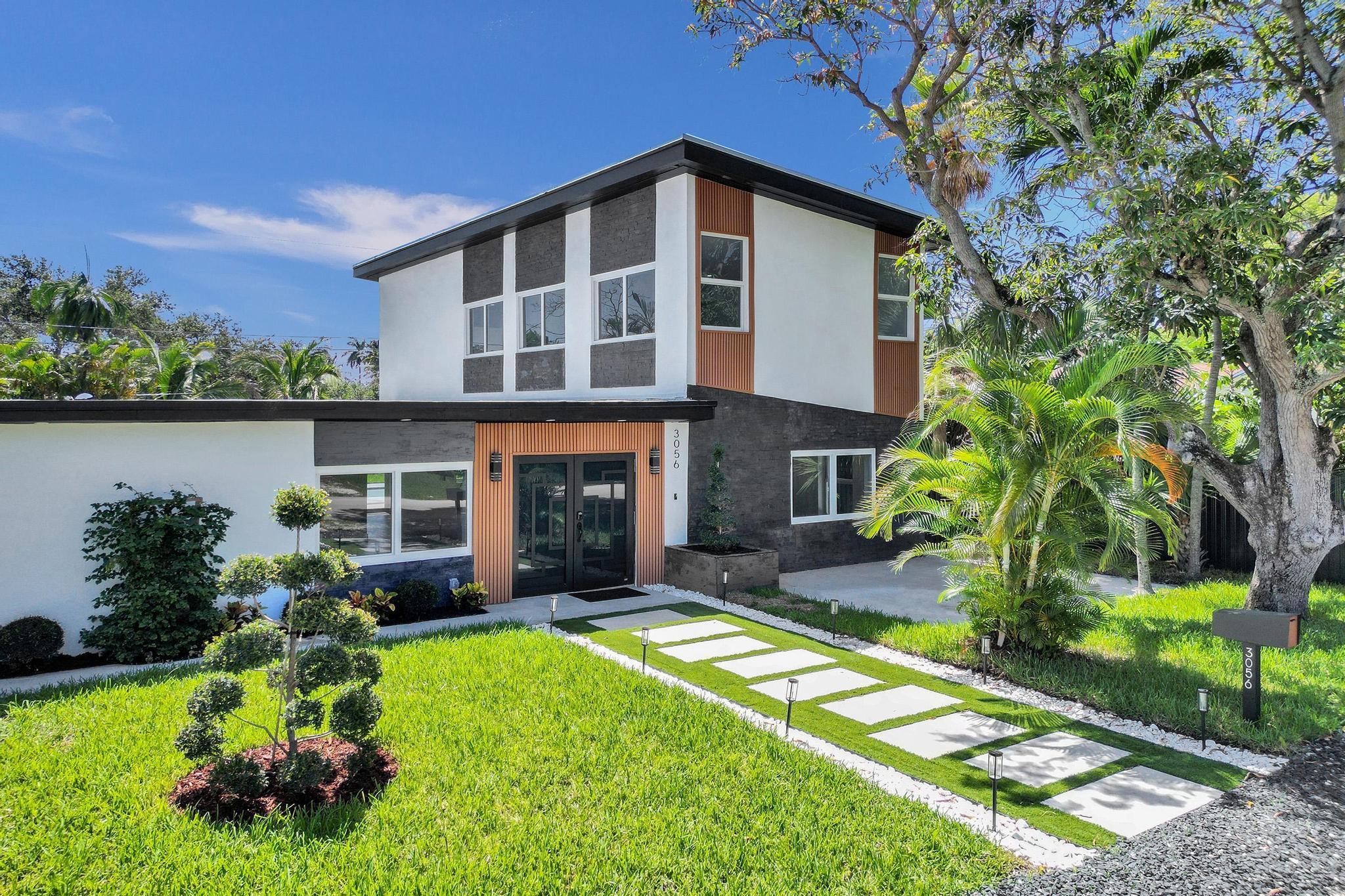 Newly remodeled, modern and beautiful two-story single-family home, ideally located just a block from Oakland Park Blvd. Enjoy a quick 10-minute drive to the beach and convenient access to US1 (5 minutes) and I-95 (10 minutes). Nestled in a prime location, you'll find yourself surrounded by trendy restaurants, breweries, bars, grocery stores, and all the shops along US1. This modern residence seamlessly blends nature and comfort, featuring mature trees and an open-concept family room. The home has been fully updated with brand-new appliances, two new AC units, a new water heater, new flooring, updated lighting, kitchen cabinets, and three stunning new bathrooms. The almost-completed pool and spacious backyard offer endless possibilities for creating your dream outdoor living space.