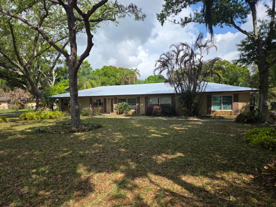 3 BEDROOM, 2 BATH  HOME WITH A POOL ON .97 ACRES  WITH A NEW ROOF METAL ROOF(2024),LOCATED CLOSE TO WALMART,HOME DEPOT,ALDI AND 15 MINUTES TO DOWNTOWN FORT PIERCE AND THE BEACH.