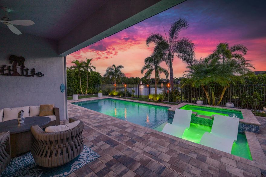 Perfect blend of indoor-outdoor living blended with understated luxury - all wrapped into this exceptional LAKEFRONT, POOL home. Featuring 3 bedrooms plus a LARGE SEPARATE DEN (can be used as fourth bedroom), 3.5 bathrooms, and 2-car garage, the home is nestled on a quiet 0.19-acre lot in the coveted, gated Banyan Bay community offering exclusive ACCESS to St. Lucie River with a fishing pier, kayak launch, pavilion, picnic table and even fish cleaning station. Notable UPGRADES include IMPACT windows and doors, soaring 10.5-11.5' tray ceilings with elegant crown molding, electric fireplace in the family room, French doors, TWO OVERSIZED PRIMARY SUITES, plantation shutters, NEW 2024 AC with transferable warranty, and fresh exterior exterior paint (2025). A full list of unique UPGRADES is available in the Document section. EACH BEDROOM features a walk-in closet and en-suite bath. The ground-level primary suite overlooks the peaceful pool and lake. The open-concept gourmet kitchen showcases an oversized island, quartz countertops, quiet shaker cabinets, stainless steel appliances, double wall oven, farmhouse sink, and pantry closet. One primary and one guest bedroom are located on the ground floor. Relax by your fully automated, heated saltwater pool (2025 motor) with sun deck, bubblers, and Jacuzzi, that are set against a tranquil lake backdrop. The private, paved patio is framed by upgraded lush landscaping, brand-new AUTO SCREENS (2025), turf, and fruit-bearing mango and avocado trees. The garage is equipped with a dedicated 220v plug for an EV charging station. Banyan Bay offers resort-style amenities including a community pool, clubhouse, and fitness center. It is conveniently located near I95, FL Turnpike, amazing downtown Stuart, grocery stores, shopping, restaurants, and Cleveland Clinic hospital. All measurements are approximate. Take a look at the 3D virtual walkthrough.