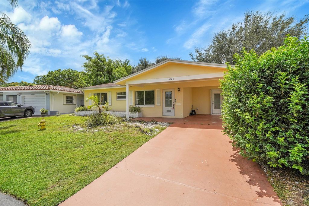 Photo of 6606 NW 59th St, Tamarac, FL 33321 (MLS # F10518537)