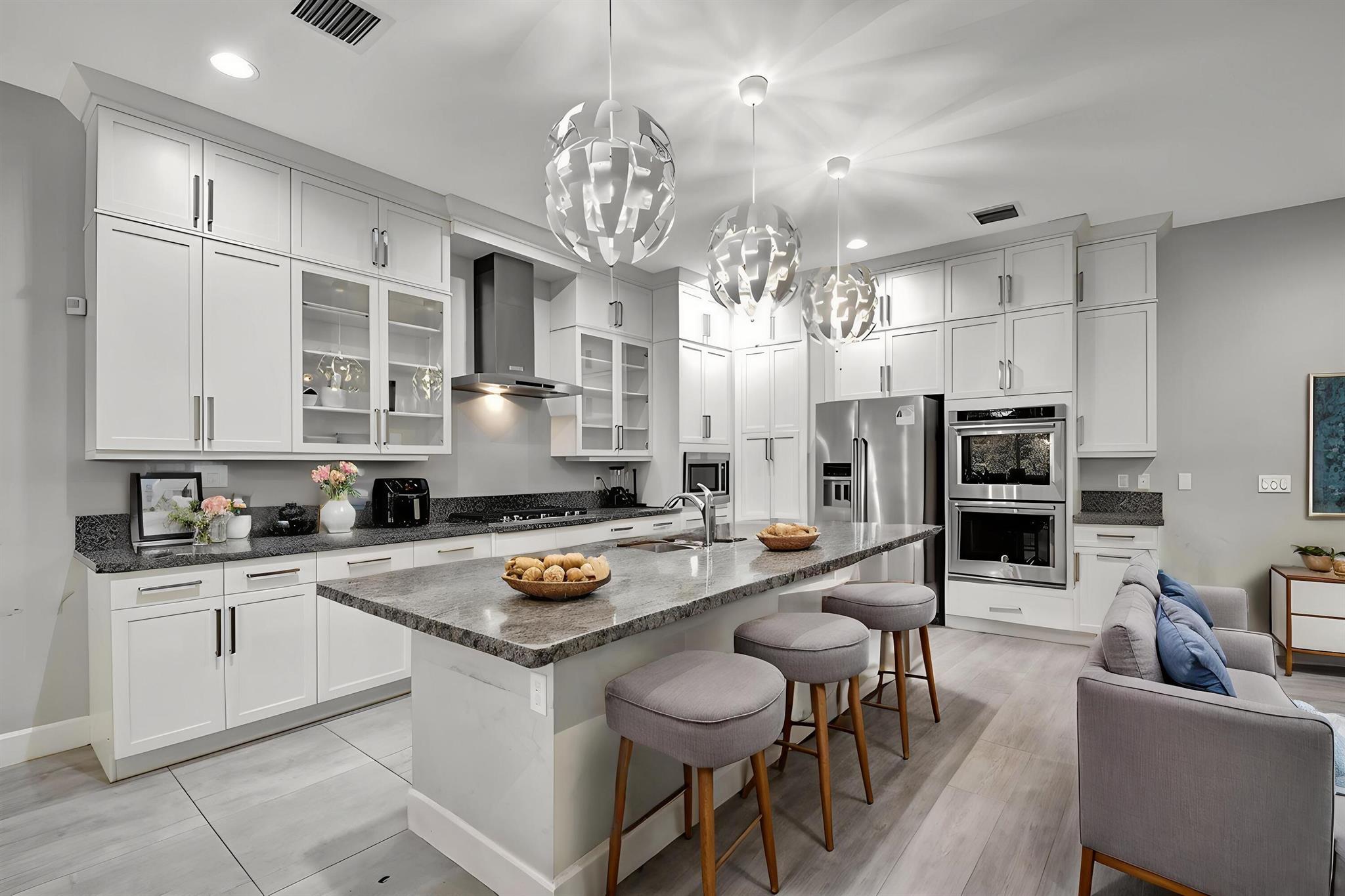 Move right into luxury in Wellington's sought-after gated community of Andalucia! This immaculate 4-bedroom, 3.5-bath home with loft offers nearly 3,900 sq ft of modern living, built in 2019 with premium upgrades throughout. The chef's kitchen boasts an oversized quartz island, gas range, and walk-in pantry, opening to a spacious living area perfect for entertaining. Enjoy peace of mind with full impact windows, a whole-home generator, and EV charger.Upstairs, a versatile loft provides space for a home office, gym, or media room. The primary suite is a true retreat with a spa-like bath and generous walk-in closets. Outside, the large fenced yard offers plenty of room for a future pool or outdoor kitchen.Andalucia residents enjoy a resort-style pool, fitness center, playground