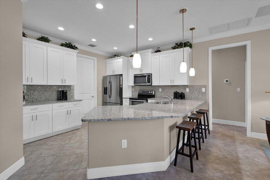 Photo of 367 SW Vista Lake Drive, Port Saint Lucie, FL 34953 (MLS # B26091400)