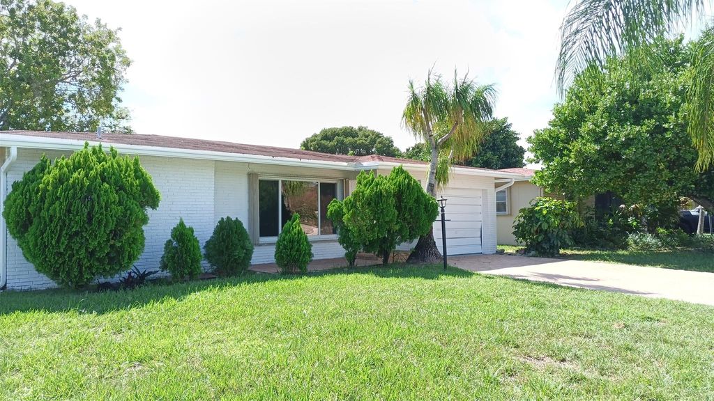 Photo of 1040 NW 49th Ct, Deerfield Beach, FL 33064 (MLS # F10532728)