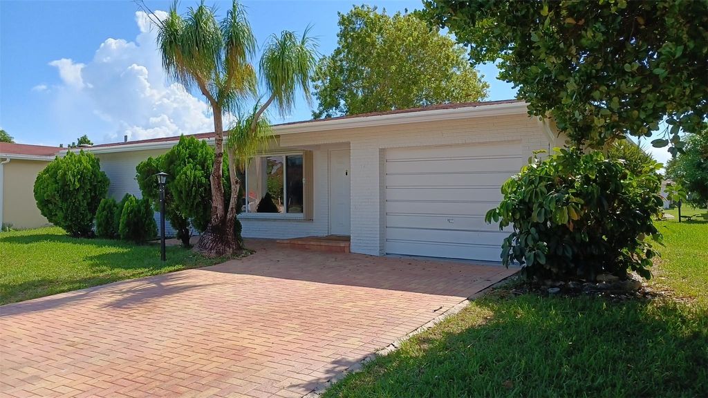 Photo of 1040 NW 49th Ct, Deerfield Beach, FL 33064 (MLS # F10532728)