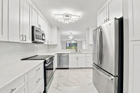 Photo of 15324 LAKES OF DELRAY Boulevard #105, Delray Beach, FL 33484 (MLS # B26090009)