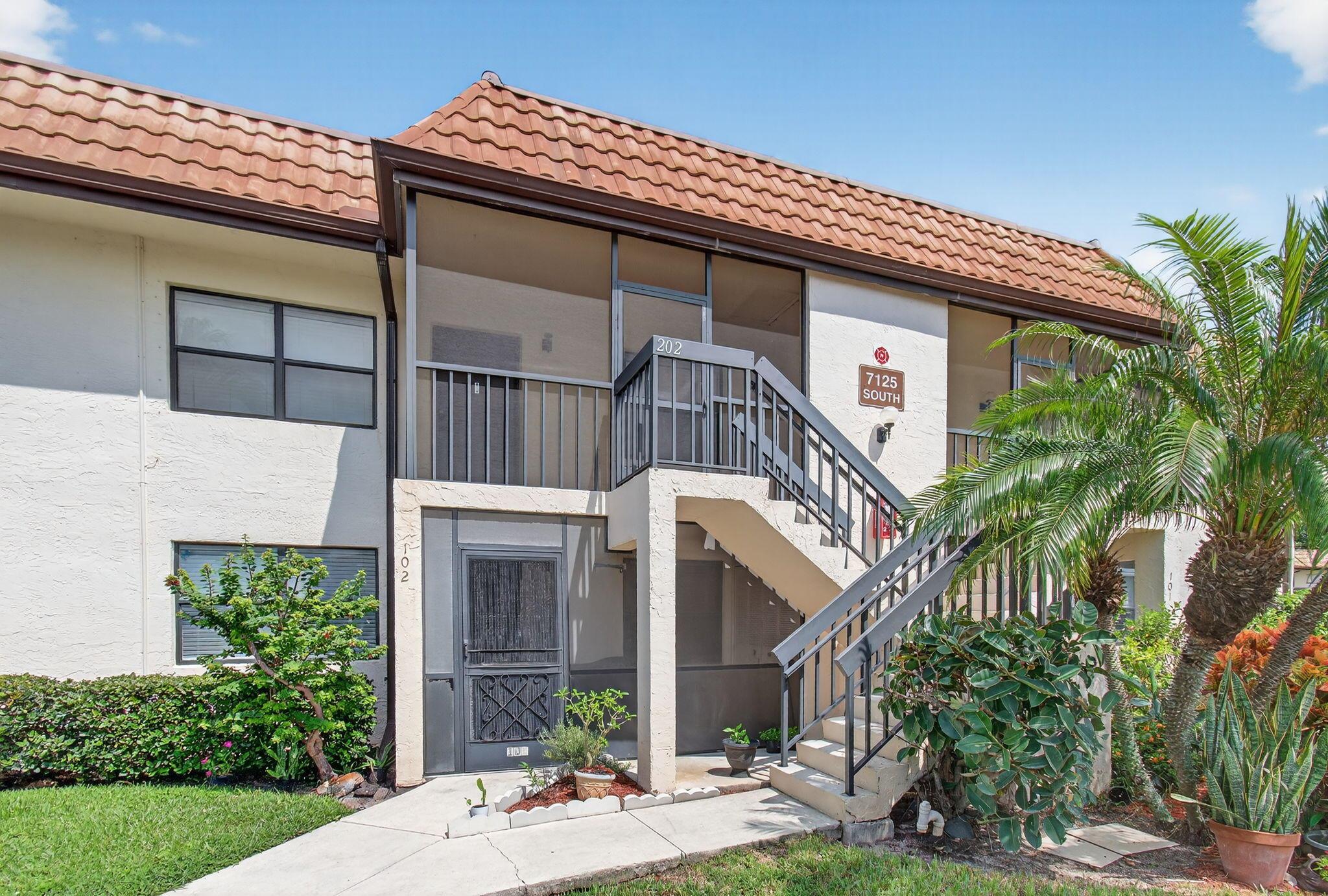 Charming and cozy 2nd-floor condo in the desirable ''All-Age'' section of Lucerne Lakes! This inviting 2-bedroom, 2-bathroom home boasts nicely sized bedrooms and modern upgrades, including granite kitchen counters, stainless steel appliances, and new flooring throughout. Stay comfortable year-round with a 2017 AC and water heater, plus a 2023 washer and dryer for added convenience. Enjoy peace of mind with metal panel hurricane protection. The main bedroom features a spacious walk-in closet. Attic space, accessible from the screened-in front porch, provides extra storage. Conveniently located near grocery stores and Florida's Turnpike for easy access to shopping and travel. Perfect for those seeking a move-in-ready home in a vibrant community!