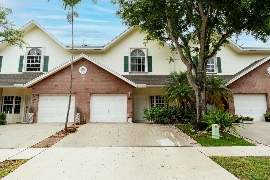 Super Rare to find, townhouse in the gated Cedar Ridge Estates, spacious 3-bed, 2.5-bath with 1-car garage. This unique home includes a finished basement ideal for an office, a 4th bedroom, storage, or gym. Residence is also equipped with a central vacuum system, accordion shutters on the upper windows, panels on the 1st level, and an Argentine outdoor grill. This gorgeous home features an open-concept kitchen/dining area, an upgraded and redesigned kitchen, and Stair Railings. Also, high-quality wood floors, tile floors, and soaring ceilings. The primary bath offers his & hers sinks and a walk-in glass shower. Conveniently located near I-95, shopping centers, dining, beaches, and within walking distance to Lake Worth Christian School and Imagine Chancellor Charter School.  Roof 2021, AC 2023, water heater 2021. Schedule your private tour today!