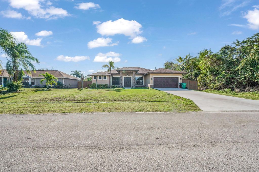 Photo of 642 SW Icon Avenue, Port Saint Lucie, FL 34953 (MLS # R10951684)