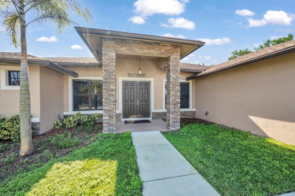 Photo of 642 SW Icon Avenue, Port Saint Lucie, FL 34953 (MLS # R10951684)