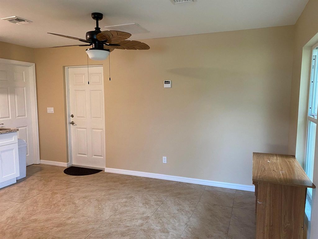 Photo of 437 SW Dagget Avenue, Port St Lucie, FL 34953 (MLS # R10908300)