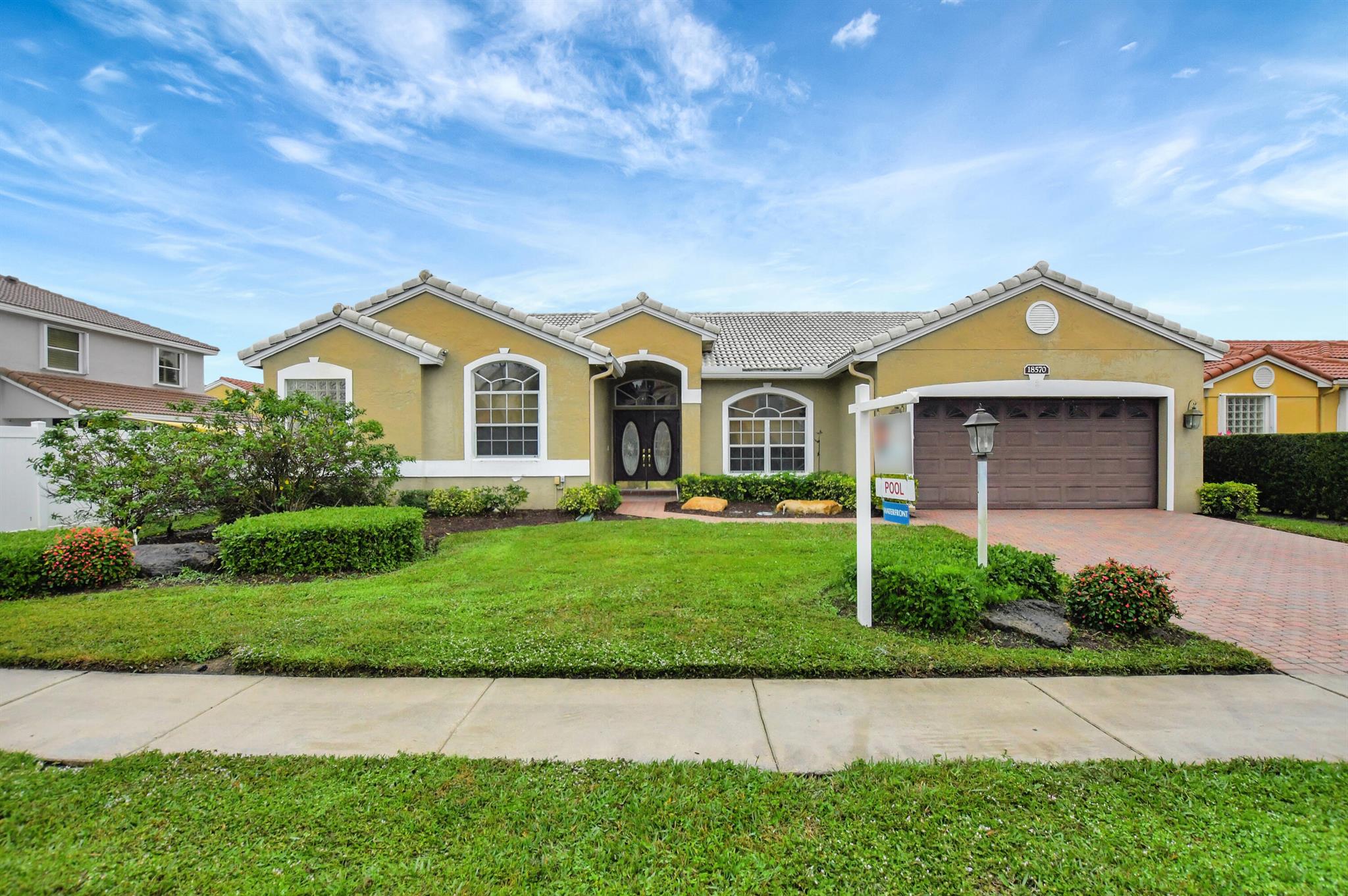 Beautiful 4 bedroom, 2 bath one story home w/screened in pool, lake views on a cul-de-sac street. Roof 2022, A/C 2017. New pool pump 2023. Kitchen renovated featuring stainless appliances, double ovens, 3 drawer refrigerator, rnsl