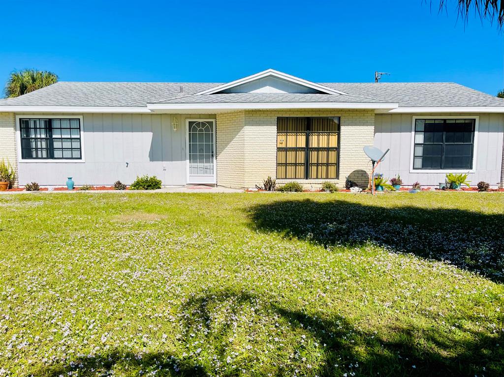 Photo of 1093 SW Cairo Avenue, Port Saint Lucie, FL 34953 (MLS # R10759149)