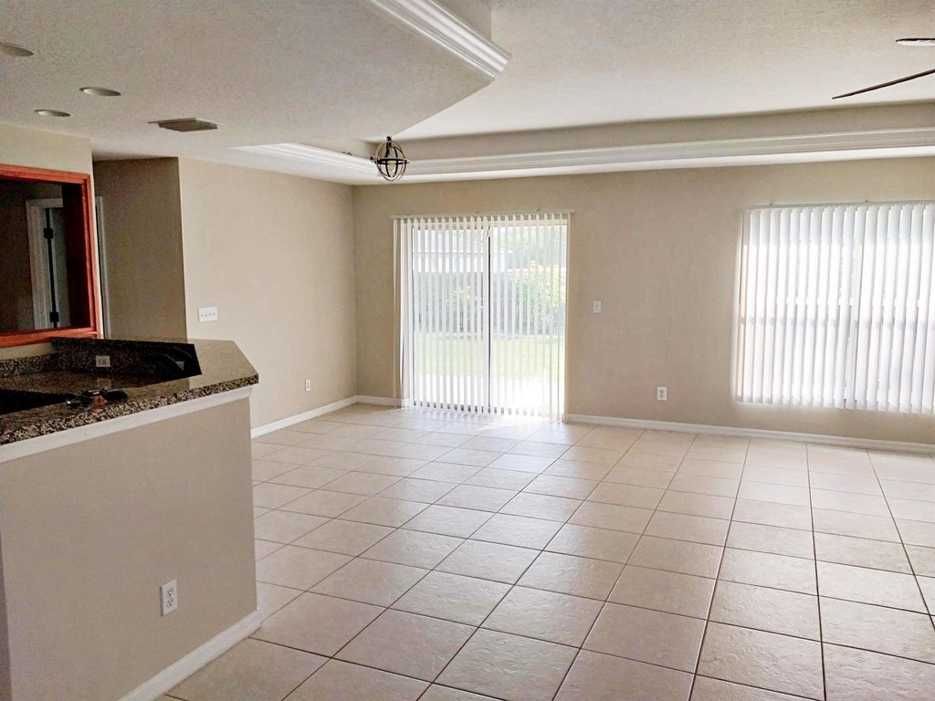 Photo of 466 SW Fields Avenue, Port Saint Lucie, FL 34953 (MLS # R11052928)