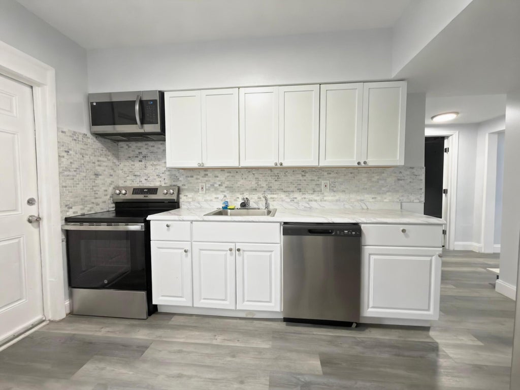 Photo of 131 E 27TH Street #6, Riviera Beach, FL 33404 (MLS # B26080322)