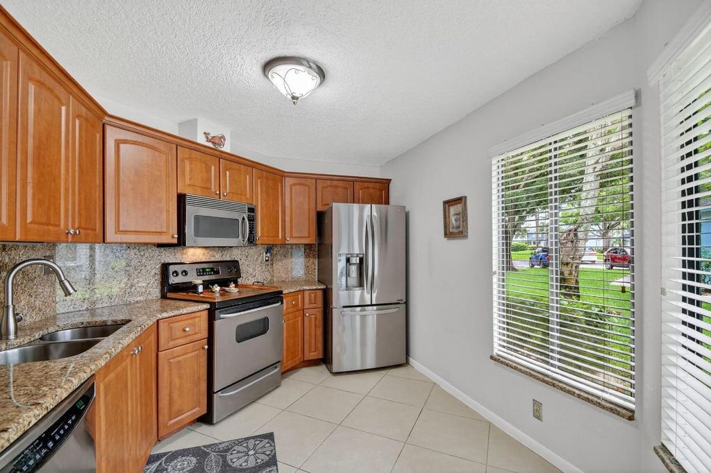 Photo of 801 Harbour Pointe Way, Greenacres, FL 33413 (MLS # R11125455)