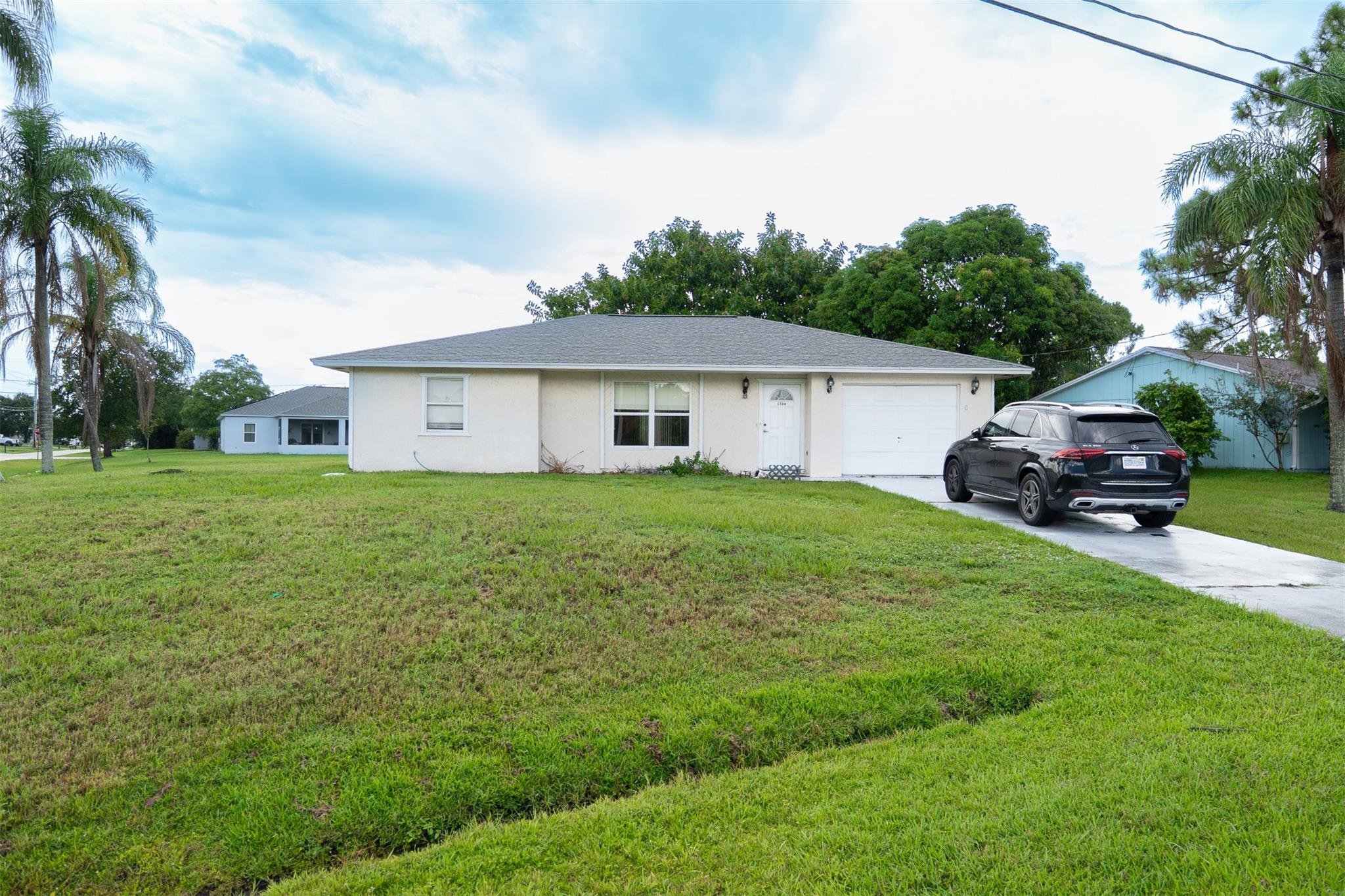 Welcome to this charming 2-bedroom, 2-bath single-family home located in a quiet, no-HOA neighborhood in the heart of Port St. Lucie. Situated on a spacious lot, this well-maintained residence features a bright and functional layout with tile flooring throughout, an open living/dining area, and a cozy kitchen with ample cabinet space. The primary suite offers a private bath and generous closet space. Enjoy Florida living with a large screened-in patio and a fully fenced backyard—perfect for entertaining or relaxing. Conveniently located near schools, parks, shopping, and major roadways, this home is ideal for first-time buyers, investors, or anyone seeking a low-maintenance lifestyle