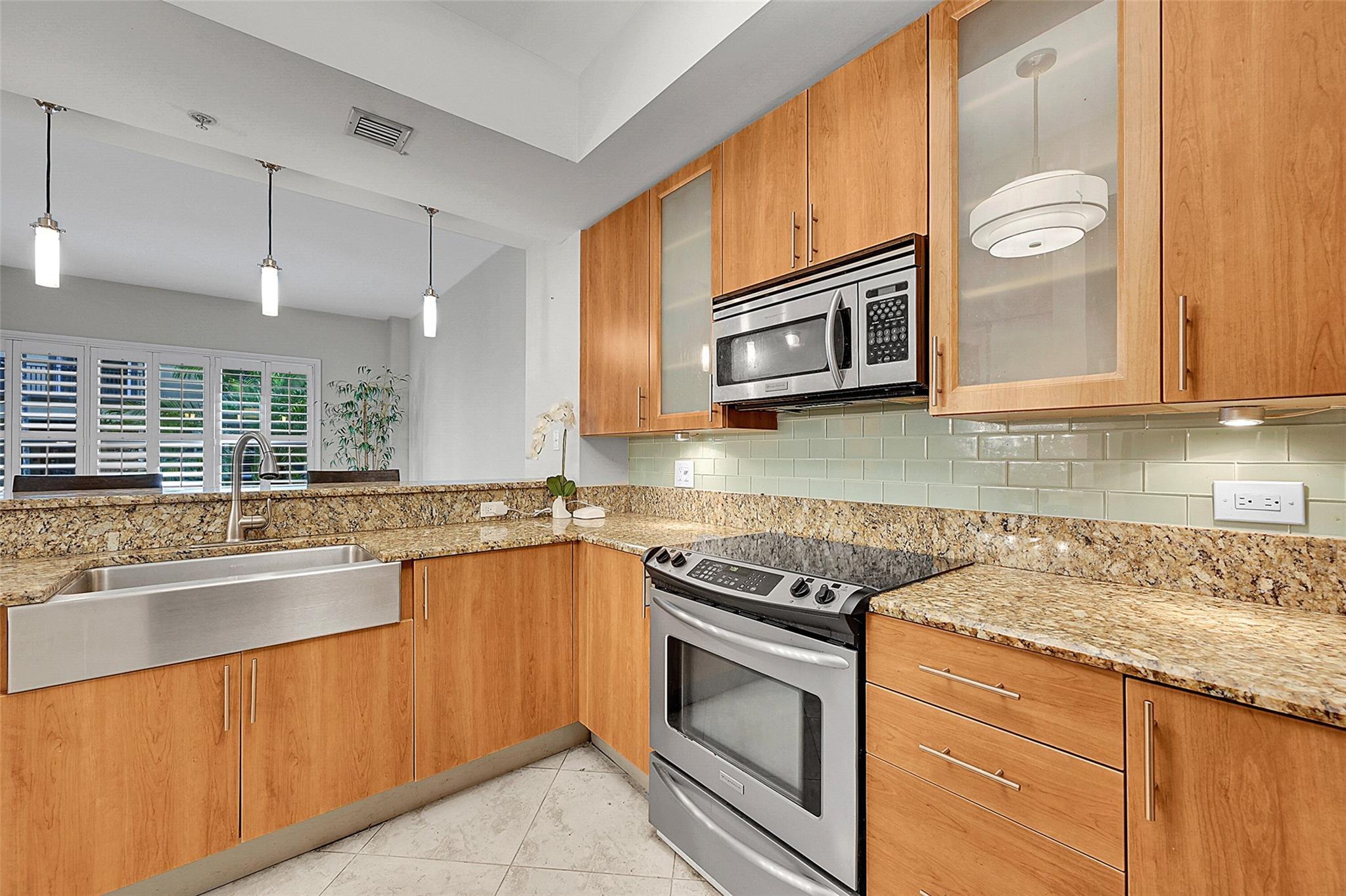 Beautiful and spacious luxury townhouse located in the highly desirable gated community of Wilton Station in Wilton Manors. This home includes 1 covered and 1 uncovered parking space and offers access to resort-style amenities: a tropical pool with two waterfalls and hot tubs, 24 x 7 large fitness center, media theater, party room with catering kitchen, EV charging stations, plus kayak, canoe, and bike storage. The open-concept kitchen features granite countertops, and the home has tile floors throughout (stairs excluded). Internet, cable, water, sewer, and trash are INCLUDED in the rent.