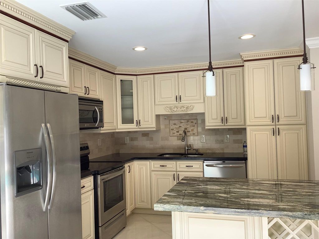 Photo of 4381 NW 1st Drive, Deerfield Beach, FL 33442 (MLS # F10429457)