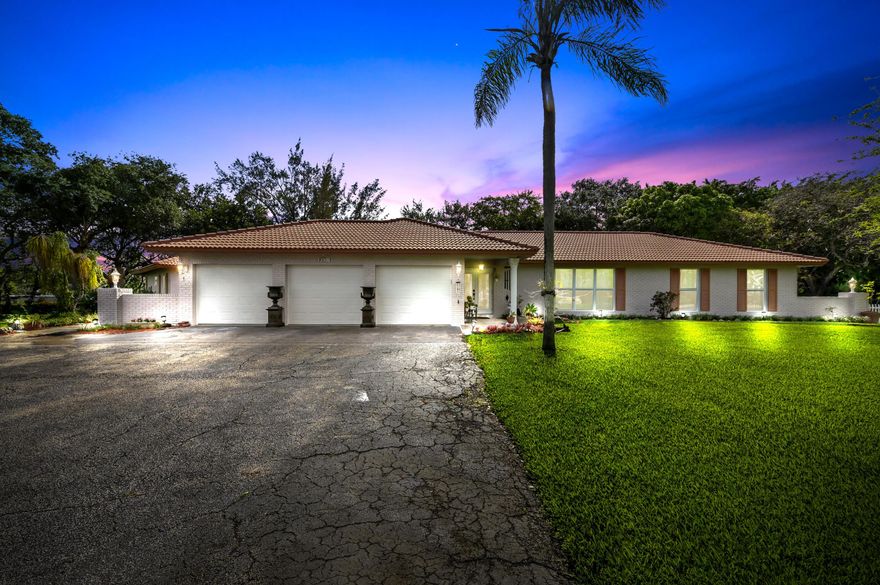 Welcome to Coral Springs Hills, a rare opportunity to own a private estate on a sprawling 1.26-acre point lot, nestled on a quiet cul-de-sac with serene canal views and no HOA. This exceptional one-story home offers the perfect blend of space, privacy, and versatility, with 7 bedrooms and 4.5 bathrooms across 3,847 sq ft of living space.  The main residence welcomes you through elegant French double doors into a grand foyer, which features a stylish guest bath with designer mirror accents. Inside, enjoy marble flooring throughout the main living areas and real wood floors in the bedrooms, creating a warm yet sophisticated atmosphere. The family room is anchored by a cozy fireplace, perfect for relaxing or entertaining.   The gourmet kitchen is designed for both function and style, showcasing granite countertops, a center island, cooktop, stainless steel appliances, ample cabinetry, and bar seating for casual dining.  Step outside to your private outdoor oasis featuring a covered and screened pool (updated in 2023), a private tennis court, and expansive grounds ideal for entertaining or enjoying peaceful waterfront living.  The property also includes a connected guest house with its own private entrance, offering 3 bedrooms and 2 bathrooms, including a Jack-and-Jill bath and hallway with closets perfect for extended family or guests.  Additional highlights include a 3-car attached garage plus an oversized driveway for ample parking, accordion and panel shutters for storm protection, and a laundry room with washer, dryer, and utility tub.  This home has been meticulously maintained and thoughtfully upgraded over the years, including:  2025: Renovated primary bathroom, washer, and PGT hurricane-impact features 2024: Dual A/C systems replaced 2023: Pool updates 2020: Electric water heater 2018: Electrical panel, front doors, side entry doors, and cabana bath door 2016: Garage doors 2008: Roof Ongoing annual professional landscaping  A truly one-of-a-kind property offering privacy, space, and resort-style amenities all in a prime cul-de-sac location.