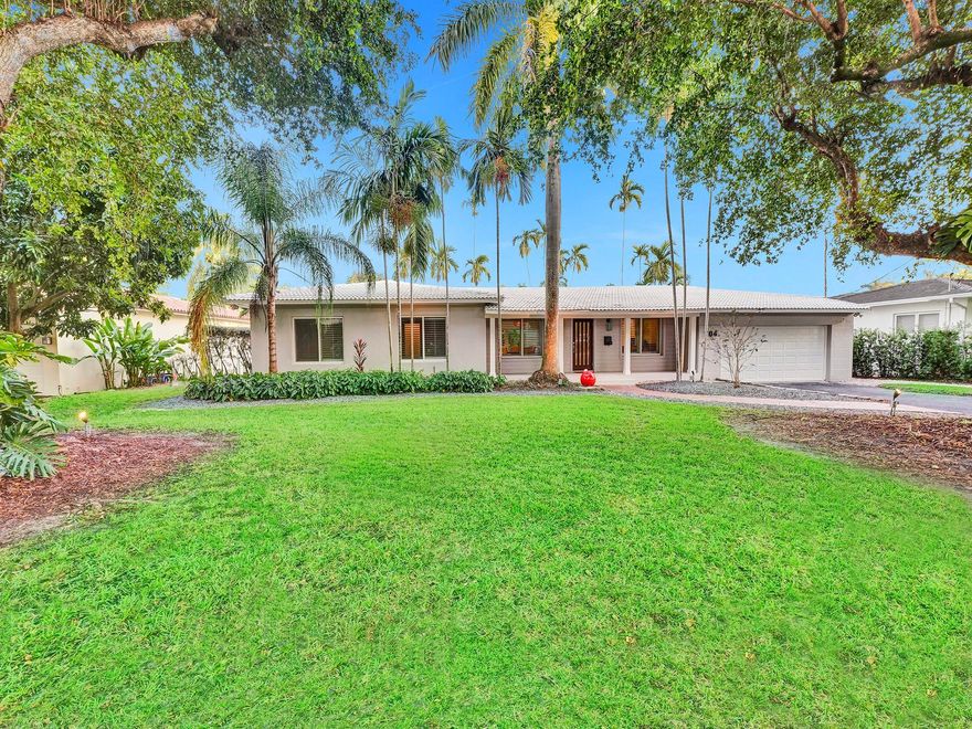 Nestled in sought-after Coral Gables sits this impressive 12,500 sq ft lot, hosting a beautifully updated waterfront home on Jeronimo Drive. In a prime location near Miami's top private and public schools. This tastefully updated 4/3 home features gorgeous waterfront views, a pool, a custom kitchen, a breakfast nook, Brazilian cherry wood, porcelain floors, updated plumbing, and impact windows & doors. It's a wonderful home for entertaining with captivating waterfront views, bright and open living space, a wine cooler, a screened-in porch, and ample outdoor space accessible from various points throughout the home. The beautifully updated bathrooms and 2-car garage provide ample storage space. Step out to an enchanting oak tree-lined neighborhood near parks, restaurants, and​​‌​​​​‌​‌​​​‌‌​​​‌‌‌​​‌​​‌‌​​​​ shopping.