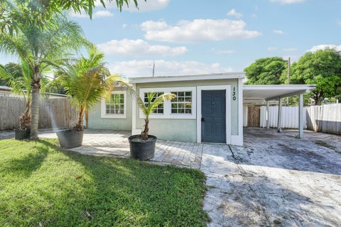 Photo of 130 PLUM TREE Drive, Lake Worth, FL 33462 (MLS # B26084811)