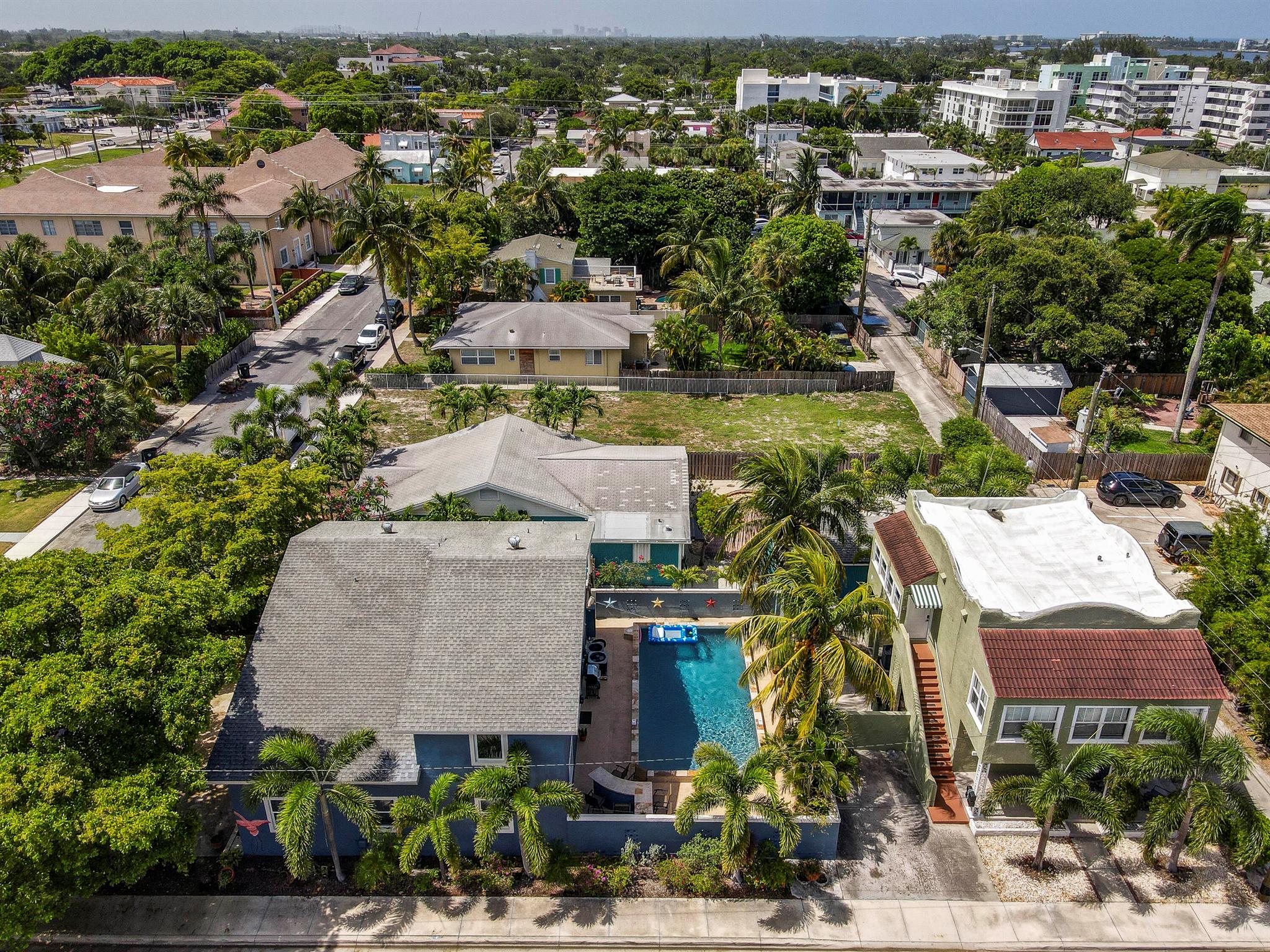 Perfectly situated near vibrant downtown Lake Worth, this unique property at 130 S Ocean Breeze offers a charming main house with 4 bedrooms and 2.5 baths, plus a separate duplex, each unit featuring 2 bedrooms and 1 bath. The main house has a generous family and dining area, sauna, and Impact glass throughout! Ideal for long or short term rental investment, residents can relax and enjoy a spacious, shared backyard complete with a pool, outdoor bar, and BBQ! The pool was recently re-plumbed and re-surfaced. Enjoy seamless, keyless living with newly installed digital locks that make access secure and effortless. Could also be an great investment opportunity for rental income!