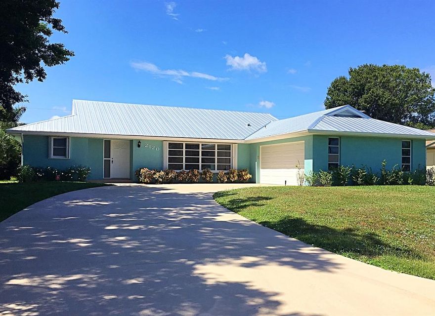Magnificent Totally redone CBS  Pool Home! 3 bedroom, 2 bath, 2 car garage with one of the largest pools I've seen in the area. Pool was totally resurface. Brand new metal roof added,  New hurricane garage door, Brand new kitchen cabinets with Granite counter tops,  all new stainless steel appliances and features a panoramic view window.  Kitchen is open to a large bright family room with wide glass door onto an enormous cover porch and screened-in pool area. Cabana Bath. Large master suite with new bath, double sinks, new Granite and shower tiles. Great sized  laundry room with Tub. The house is freashly painted inside and out with an amazing crub appeal and key west Look. This is a must see!  Make it your own Home / Resort!!