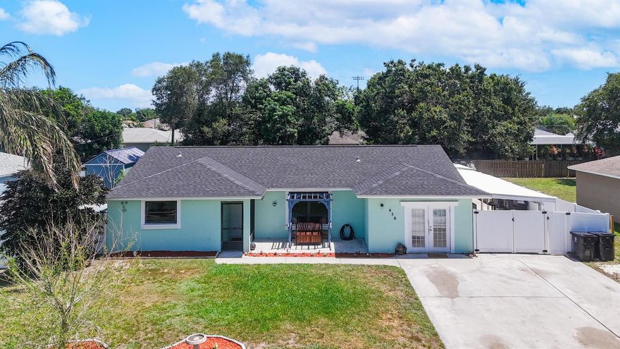 Spacious 5BR/2BA home in Port St. Lucie with 2 rooms featuring private exterior entrances--perfect guests! No HOA, 1,900 sq ft under air, 3,100 total. Updated kitchen with granite countertops & stainless steel appliances. Large tile floors throughout. New roof (2022), screened patio, extended carport, 2 sheds, above-ground pool, and built-in dog house. Fully fenced yard with several fruit trees. A rare find with space, flexibility, and outdoor features galore!