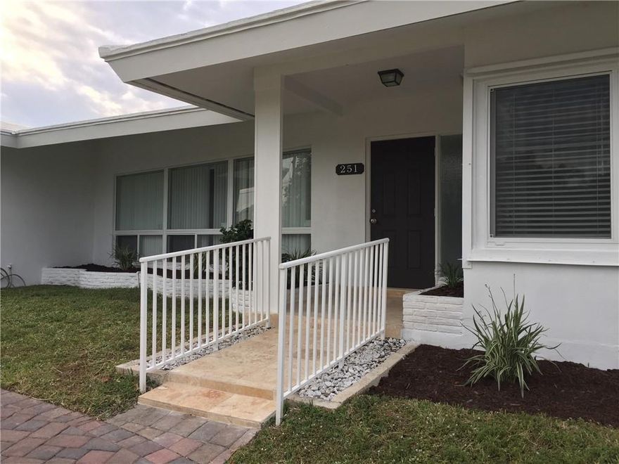 Beautiful Home in a desirable coastal neighborhood with short distance to the Pier and Beach. Bright & Open floor plan. Large corner lot. Circular driveway.  Impacted windows. Completely remodeled from the framing stage: newer kitchen with granite counter-tops and stainless steel appliances, tiles flooring throughout, bathrooms, and air conditioning. Separate laundry room. Carport with storage area. Three bedrooms with three full bathrooms in split bedroom plan.