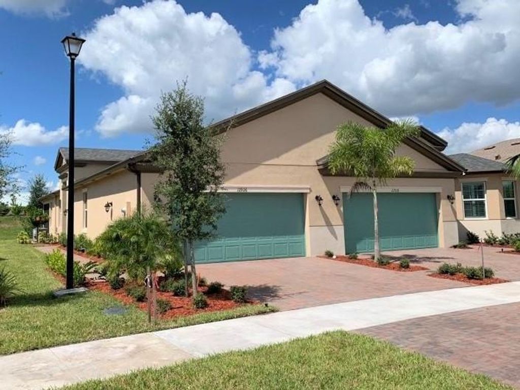 Photo of 12926 SW Lake Fern Circle, Port St Lucie, FL 34987 (MLS # R10886095)
