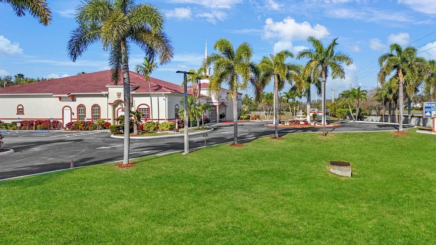 This stunning 8,644 SF building is situated on a meticulously landscaped 4.91-acre property with over 1,000 feet of frontage on Hypoluxo Road. Approximately 3.5 acres are fully fenced, providing added security. Built in 2011, the facility is thoughtfully designed and includes a main sanctuary, fellowship hall, prep kitchen, offices, Sunday school rooms, a mezzanine, a lobby, and multiple lavatories, including separate men's and ladies' facilities along with two additional restrooms. The property offers ample parking for 70+ vehicles, with additional space available for expansion. A previously approved Phase 2 plan allows for an additional 20,000 SF building, presenting a great opportunity for future growth. The building is equipped with modern amenities, including security cameras, a burglar alarm system, an acoustical ceiling, a fire sprinkler system, a high-quality sound system, and a combination of carpet, laminate, and concrete flooring.  The exterior grounds are equally impressive, featuring a circular driveway, concrete sidewalks, parking lot lighting, and beautifully maintained palm trees that enhance the overall aesthetic of the property.