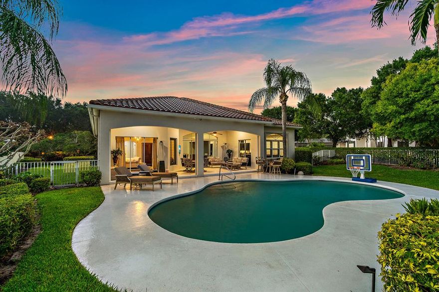 Admirals Cove beautifully updated 4 bedroom, 3 1/2 bath home situated on an overly generous .54 acre lot. Bright and open floor plan with a gourmet chefs kitchen equipped with 4 Fisher and Paykel dishwasher drawers, Sub Zero refrigerator, with 2 additional cooling drawers, Wolf double oven with 6 burner gas stove, stainless hood, eat in bar area and quartz countertops with mosaic tile backsplash.  Great room finished with a wet bar creates the ideal space to entertain guests.  Luxurious primary suite with seating area and a primary bath with 8'' triple rain shower, double vanities and custom finishes.  Roof approximately 2014.  Covered lanai leads to the private backyard with sparkling free form pool and fully fenced in yard space with plenty of grass area for the kids and dogs to play.