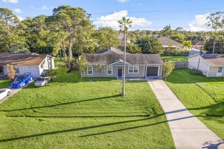 Photo of 132 SW Thornhill Dr, Port Saint Lucie, FL 34953 (MLS # R11059634)