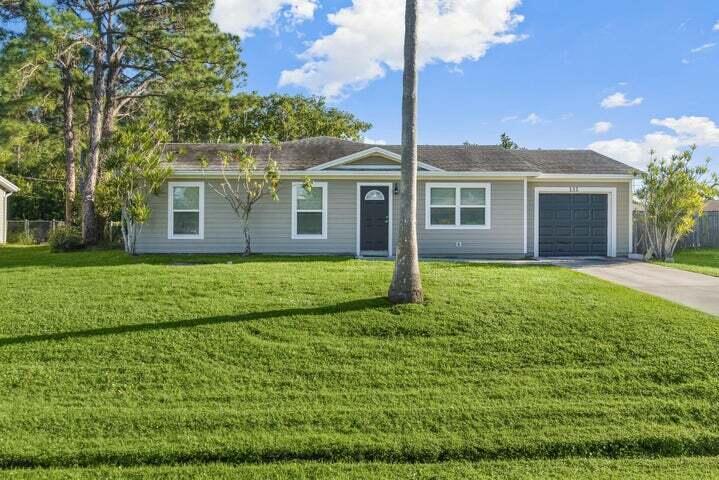 Photo of 132 SW Thornhill Dr, Port Saint Lucie, FL 34953 (MLS # R11059634)