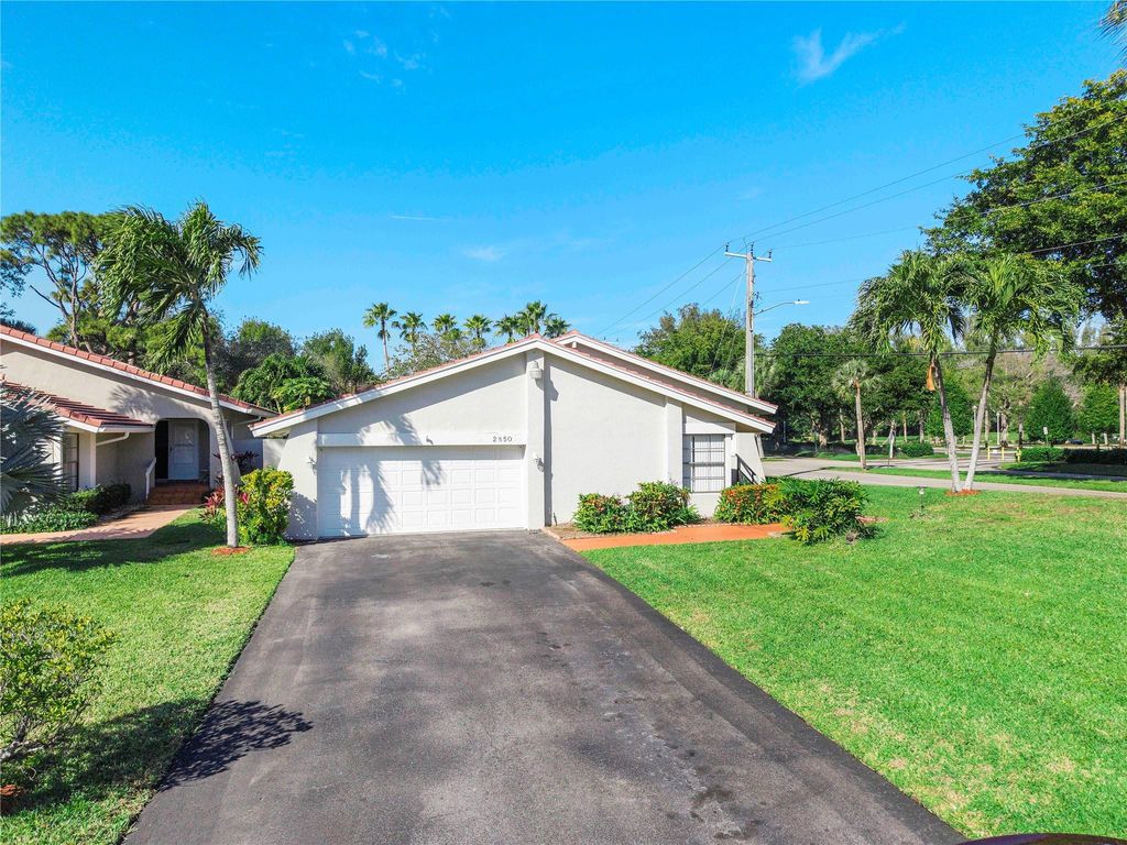 Photo of 2850 Deer Creek Kelly Brooke Lane, Deerfield Beach, FL 33442 (MLS # F10550301)