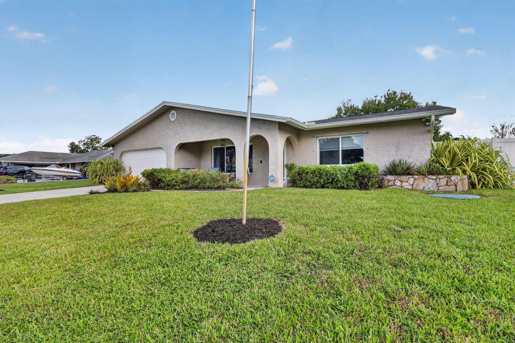 Photo of 2381 SE Delano Road, Port Saint Lucie, FL 34952 (MLS # B26069800)
