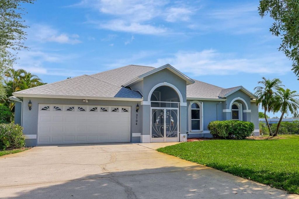 Photo of 2704 SE Eagle Drive, Port Saint Lucie, FL 34984 (MLS # R10989059)