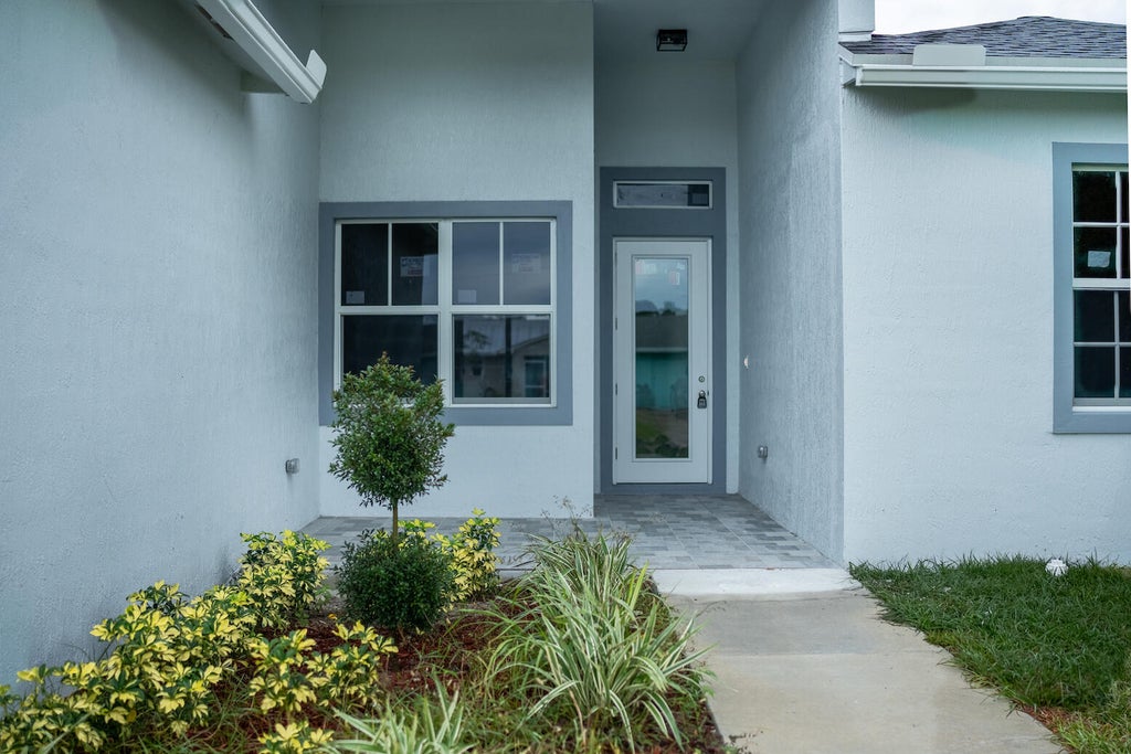 Photo of 2026 SW Aquarius Lane, Port Saint Lucie, FL 34983 (MLS # R10948600)