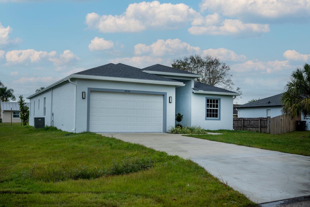 Photo of 2026 SW Aquarius Lane, Port Saint Lucie, FL 34983 (MLS # R10948600)