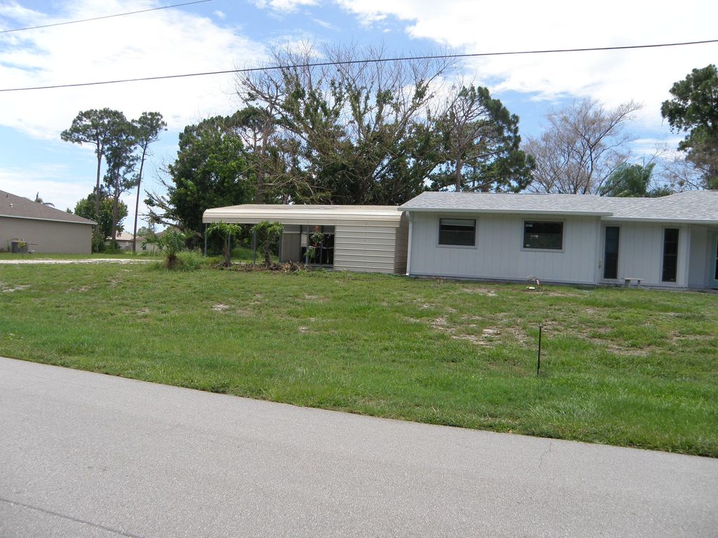 Photo of 322 SE Walters Terrace, Port Saint Lucie, FL 34983 (MLS # B26037855)