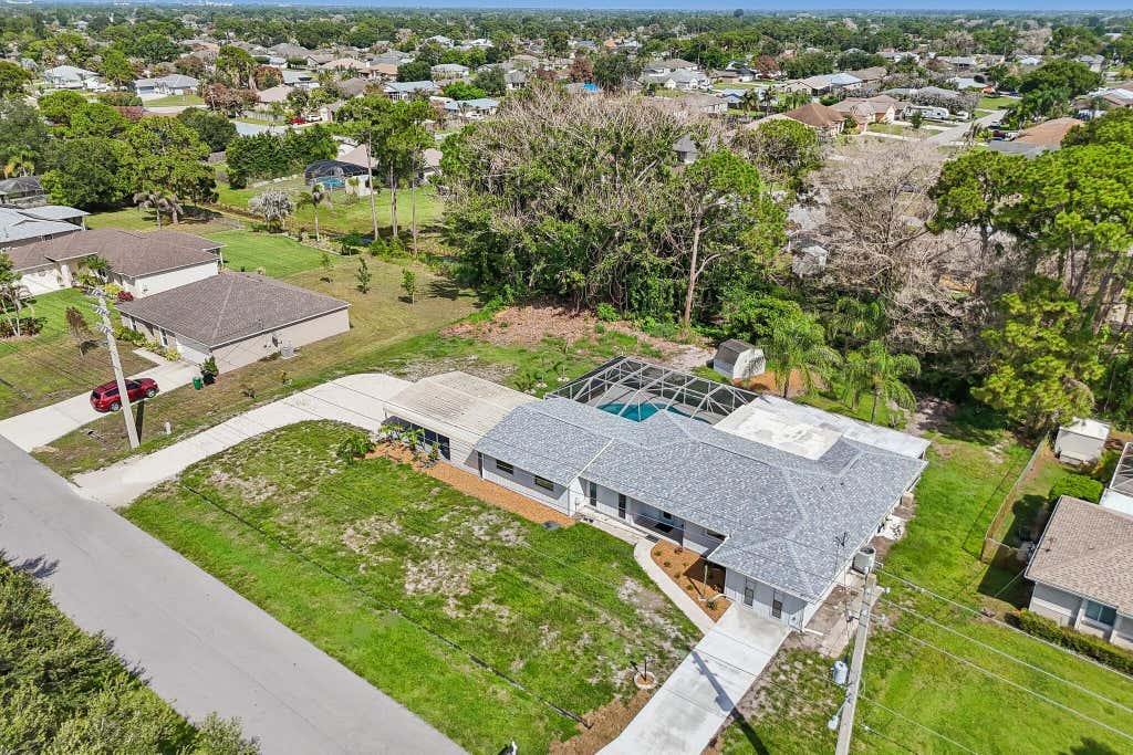Photo of 322 SE Walters Terrace, Port Saint Lucie, FL 34983 (MLS # B26037855)