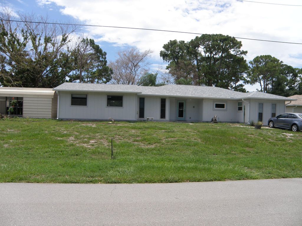 Photo of 322 SE Walters Terrace, Port Saint Lucie, FL 34983 (MLS # B26037855)