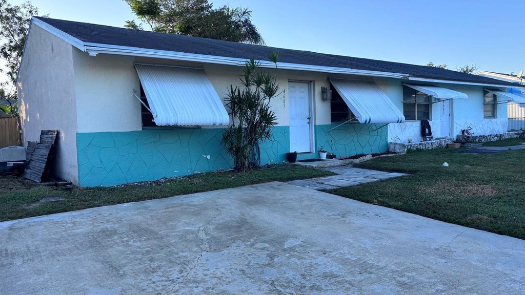 Photo of 4663 Empire Way, Greenacres, FL 33463 (MLS # R11137976)