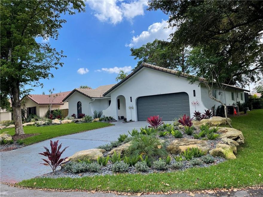 Nestled in a quiet Coral Springs neighborhood, this stunning home has been completely remodeled to perfection. No detail overlooked. Incredible open floor plan blends modern luxury, elegance & state-of-the-art details. The neutral, yet inviting porcelain wood-look floors, quartz countertops, complete w/hihats throughout are features that make this home truly exquisite. Kitchen comes complete w brand new, never used stainless steel appliances and custom cabinetry.  The spacious bedrooms and beautifully appointed bathrooms offer a peaceful retreat. The outdoor living area is perfect for relaxing or entertaining while enjoying the beautiful fully screened pool and all new lush landscaping. All new windows/doors.  Every corner of this home has been thoughtfully updated. Complete w Tesla SOLAR! o INTERIOR? Entry  • You will be met by a stunning combination of subtle colors and light that will make you feel like you have just entered a modern home ready for your furniture and family• The modern open foyer sets the tone for this home's grandeur and sophistication, welcoming you with its light and open feel.  ? Living Room• The living room is seamlessly integrated into the floor plan and is not only visually stunning with its clean lines but also perfectly functional for today's family with space for ample seating, integrated technology, and a view of the landscaping and welcoming pool.? Kitchen• The magnificent brand new eat-in kitchen is the epitome of style and functionality, featuring upscale stainless steel appliances, Quartz countertops, custom cabinetry and a spacious dining area that's perfect for today's family to gather and enjoy meals together.? Family Room• The family room, opens to the eat-in kitchen and has direct access to the pool area, provides the perfect space for today's family to relax, entertain and enjoy quality time together in a stylish, comfortable setting.? Bedroom 1• The comfortable bedroom offers ample space and versatile room that can easily adapt to a family’s growing and changing needs.? Bedroom 2• The bedroom features a generous walk-in closet and is perfectly sized to provide ample and functional space to relax and recharge in style.? Bath 1• The beautiful all new secondary bathroom is complete with double sinks, Quartz countertops, large drawers for storage, and a shower/bath combo, with rain shower head and hand-held on an adjustable arm creates a calming oasis where one can get ready in the morning or wind down at night in comfort and style.? Primary Bedroom and Closet• The perfect primary bedroom boasts breathtaking views of the beautiful pool just outside its French doors, creating a serene and tranquil retreat where you can unwind and enjoy the ultimate in relaxation. The space also features a large walk-in closet with custom built-ins that provides ample storage while enhancing the room's overall design and functionality.? Primary Bath• The luxurious primary bathroom is complete with new custom his and her separate vanities, a relaxing walk-in shower with rain head and hand-held that creates a spa-like experience and can melt away the stresses of the day, providing the ultimate in comfort and luxury.o EXTERIOR? Pool• Never want to leave your home with its’ beautiful large screened-in area.  This is the perfect place to entertain and relax, featuring a fire pit for cool evenings and a crystal-clear pool for refreshing fun, all surrounded by new LED lighting and state-of-the-art new equipment that will ensure enjoyable and hassle-free leisure time.? Landscaping• The all-new corner-to-corner landscaping beautifully blends the stately trees that define the neighborhood with new, fun, and visually pleasing plants and flowers, and features all new sod that creates a lush and inviting outdoor space. The oversized corner lot offers plenty of room for a front privacy coffee space, playing catch on the side yard, and more, making this visually stunning outside area the perfect place for everyone to enjoy.? Security• The home is equipped with the latest security and functional features, including a Ring doorbell and three cameras that allow for remote phone viewing and 24/7 monitoring through a convenient app, giving homeowners peace of mind.? Solar• The home comes with brand new Tesla solar panels, fully warrantied for 25 years!  You can have electric bills as low as $20-$40 per month. If your FPL bill averages $200+/month before solar, that will amount to a huge savings AND further FPL increases won’t affect you, your monthly savings will just keep growing!o MISCELLANEOUS•  Upgraded Electrical Service and Panel•  All New Pool equipment•  All New Hurricane rated windows and French doors•  All New Sprinklers, Sprinkler pump and manifold•  Designer Porcelean tile throughout•  Quartz Designer countertops and backsplash •  LED hihats everywhere!•  Designer Light fixtures (interior and exterior) and above and undercabinet lighting•  Brand new never used, fully warranteed appliances•  A/C Unit and ducts and Dryer Vent, cleaned and sanitized•  Custom Kitchen & bath cabinets with sought after upgrades: soft close, pull outs, trash rollouts, spice pullouts•  Primary Bedroom Closet features floor to ceiling custom built-ins•  Upgraded bathroom fans are virtually silent•  Custom base moulding and door casing that is vacuum dent resistant, super smooth, maintenance free!•  Sherwin Williams Paint inside and out!•  New quiet Garage door opener with outside keypad•  10 year, NO - battery - Change smoke detectors throughout•  LED / No fog, Super Bright Lighted mirrors over all Bath Vanities•  Each Bath is equipped with luxurious rain head, hand held on slide bars and waterfall spouts and faucets