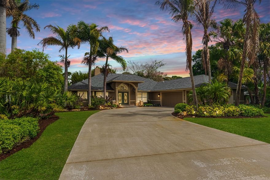 Waterfront living meets effortless entertaining—bring your boat and step into your private paradise. This custom 3BR/2BA main home plus 1BR/1BA guest house offers an open, inviting layout with a chef's kitchen featuring induction cooktop, double wall ovens, butler's pantry, and dual wine fridges. The great room impresses with a wood-burning fireplace, pool table, and seamless flow to the screened pool via new impact sliders. Relax in the heated pool and spa, or host at the tiki bar and outdoor grill. The primary suite is a retreat with spa bath, hidden dressing room, and nearby laundry. Set on ½ acre with private dock on c24 canal with 9,000 lb lift, ocean access/no fixed bridges, 3-car garage, generator, 2023 roof & 2025 A/C—this is true Florida living. Schedule your showing today!