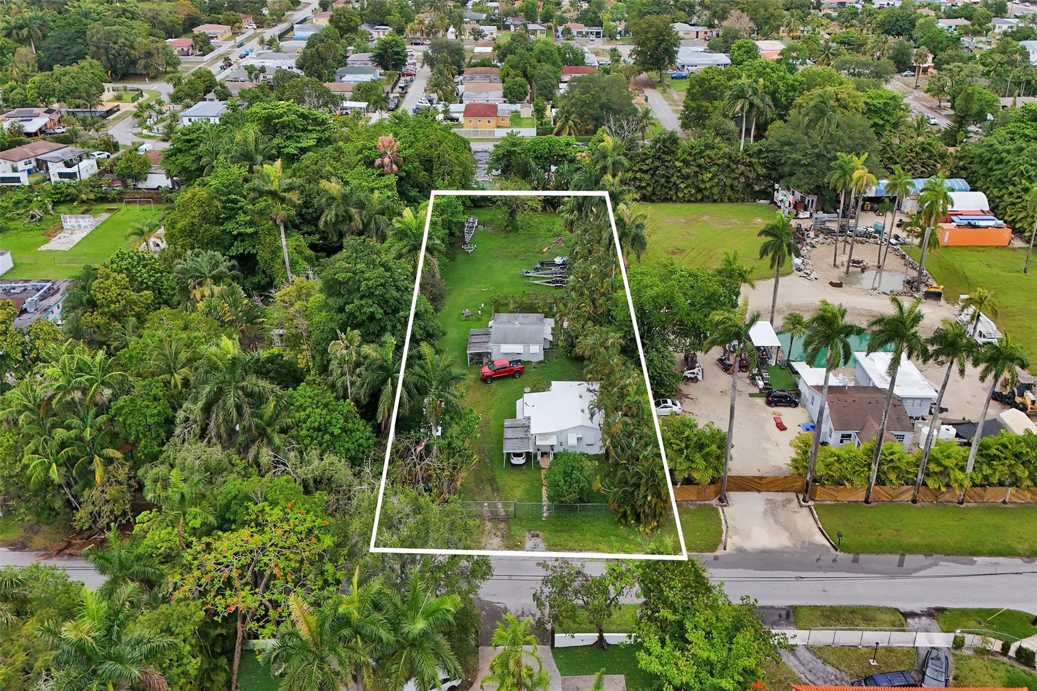 Tremendous investment opportunity in NE Dade. Property currently has 2 detached units but is primed for Development. Perfectly located near the NE 6th Ave Corridor this could be a Spec Home, Church or a Mini Subdivision. The property has 30,000 sq ft of land and is close to everything. Property is also being offered with 453 NE 154th St next door and would provide over 70,000 sq ft of land for development.
