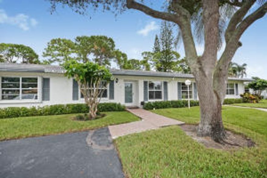 One of the nicest locations in the community. Beautiful greenbelt area behind the residence. Pavers extended in the front and back. Hurricane glass front doors and impact glass windows. Phantom screens front and back. Plantation shutters in every room. Just painted. All new 18''x 18'' tile with 7'' baseboards. Updated kitchen with granite; appliances added in 2012 to include refrigerator, range & microwave. New dishwasher added in 2015. Ultraviolet light air purifiers. All new electric sockets. New A/C installed in 2014. 2 walk-in closets. Bathrooms redone with new showers, new toilets, new tub & sinks. Full size washer & dryer. Over $50,000 in upgrades. A must see!