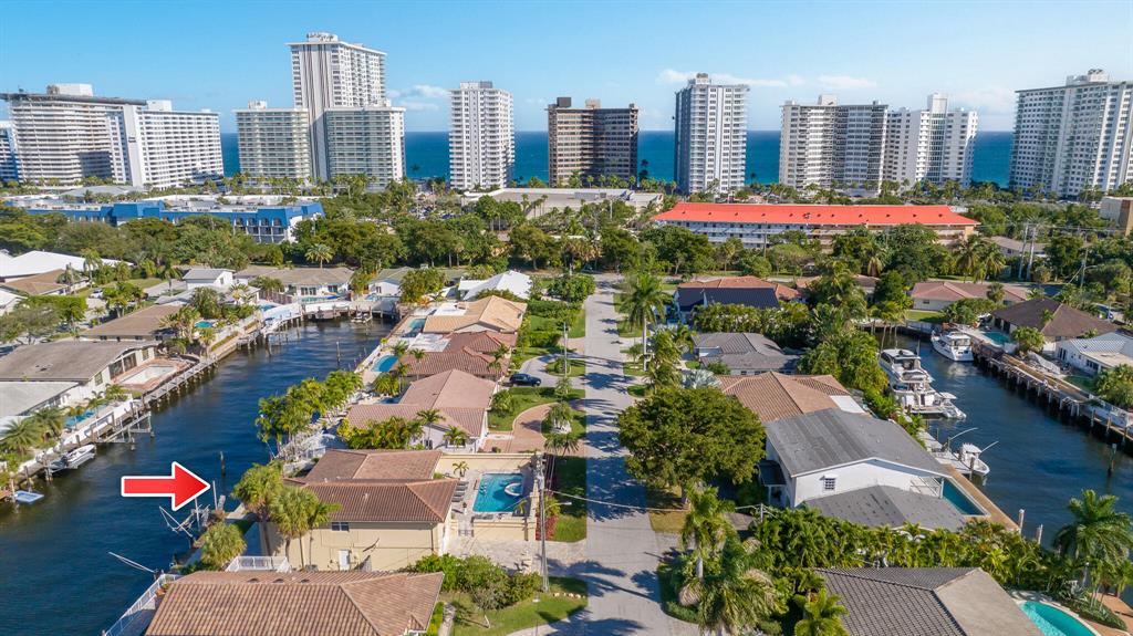 Make sure you book an appointment to see this large and spacious 2,946 square foot waterfront home with 5 bedrooms and 4 bathrooms! Located on the island side of the intracoastal, in the exclusive community of Bermuda Riviera, you can walk to the beach in less than 10 minutes or get there even faster on a bicycle. The living room is nice and bright with genuine hardwood floors and has a view of the canal with your own private dock, only 6 houses in from the intracoastal waterway. Adjacent to the living room you will find a formal dining room, conveniently located across from the kitchen. A fully equipped kitchen features granite countertops, stainless steel appliances, lots of cabinets, and a kitchen window that when opened becomes a serving station/bar counter to the pool.